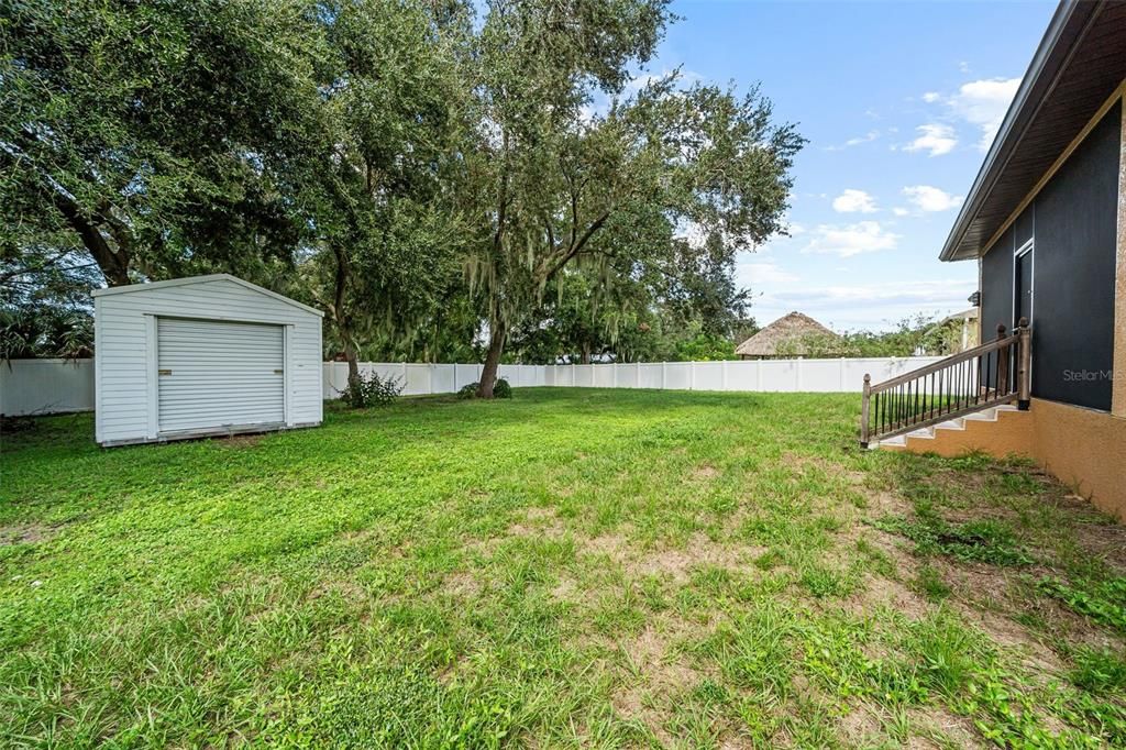 Huge backyard with extra storage unit