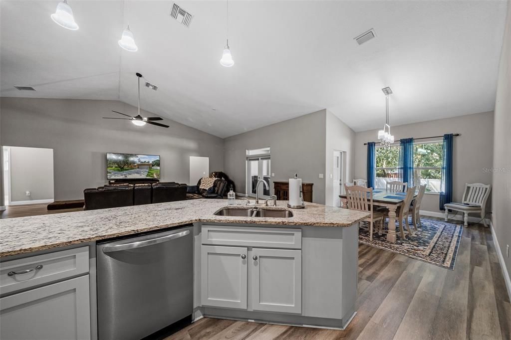 Kitchen facing open floorplan living area