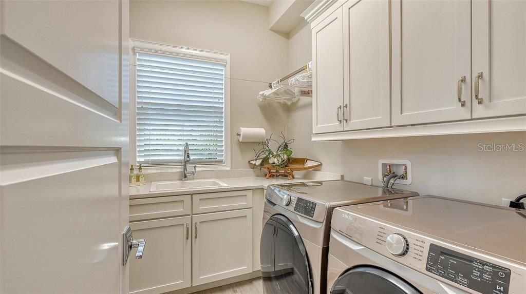 Laundry room across from walk in panty