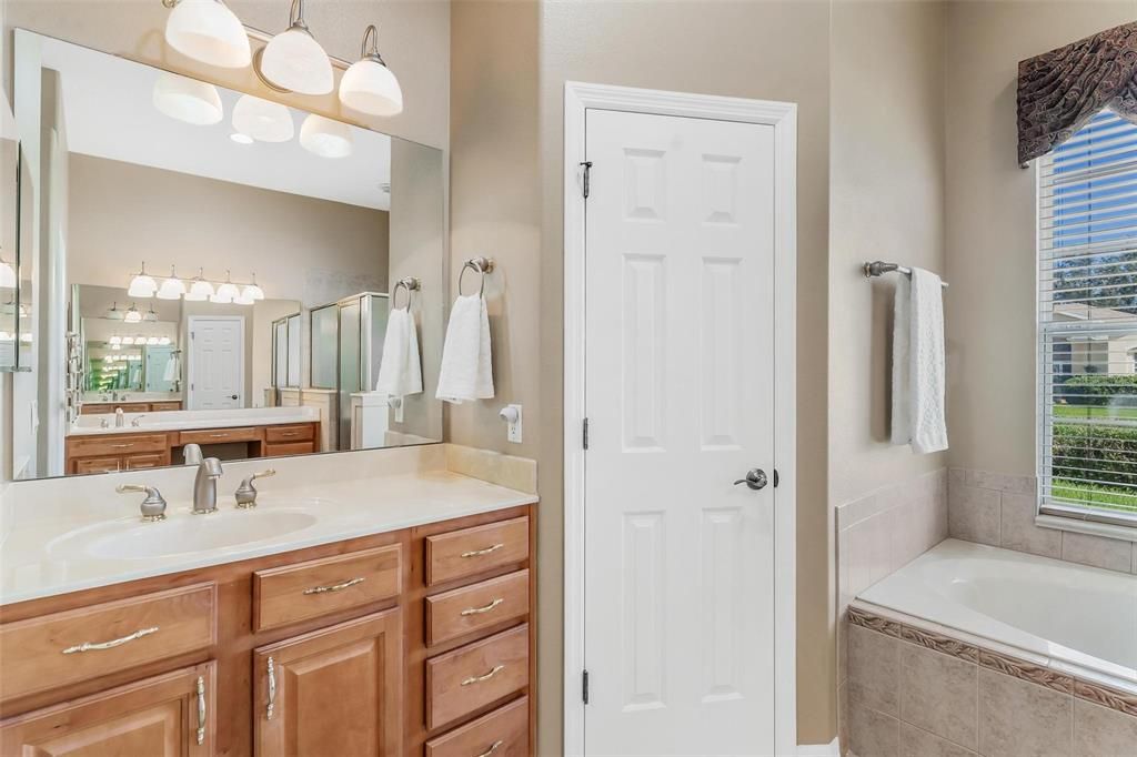 Primary Bathroom with Linen Closet with a Pocket Door