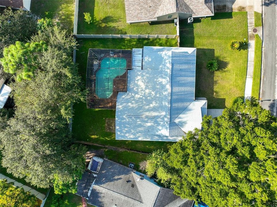 The lanai and pool are screened for maximum comfort and overlook a FULLY FENCED BACKYARD.