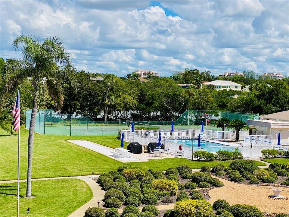 Pool area, outside grill and tennis courts