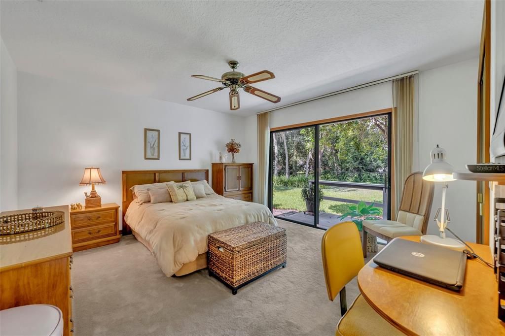 Large Guest Bedroom With Beautiful Backyard Views