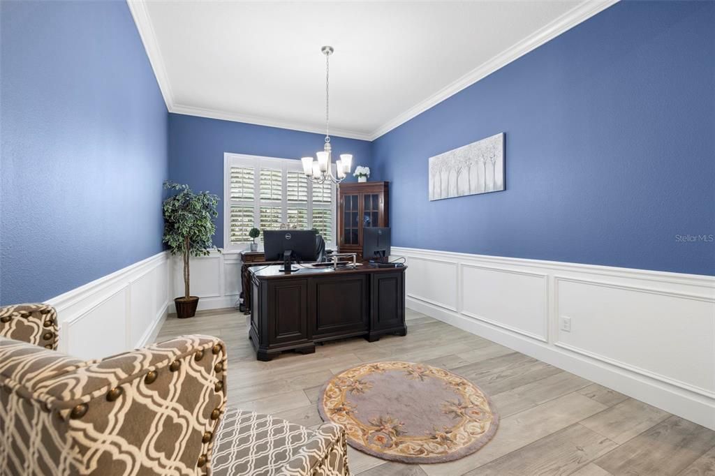 Large Den/Formal Dining Room with Custom Wainscotting & Plantation Shutters.