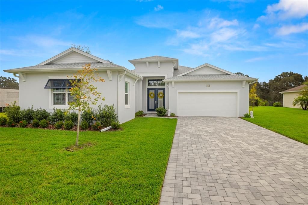 New Home Built in 2023 by Biscayne Homes, Pavers at Driveway, Walkway & Lanai & Gutters