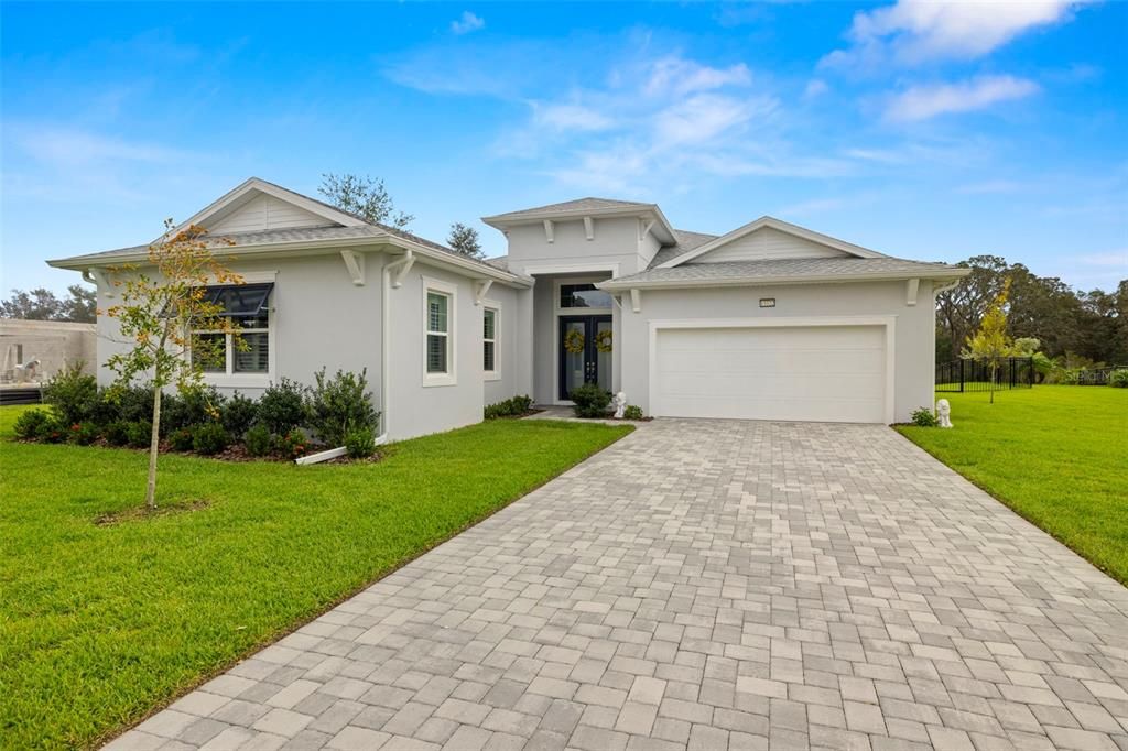 New Home Built in 2023 by Biscayne Homes, Pavers at Driveway, Walkway & Lanai & Gutters