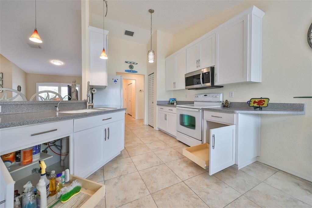 Pull Out drawers and soft close cabinet doors.  Contemporary porcelain tile throughout the entire wet area.