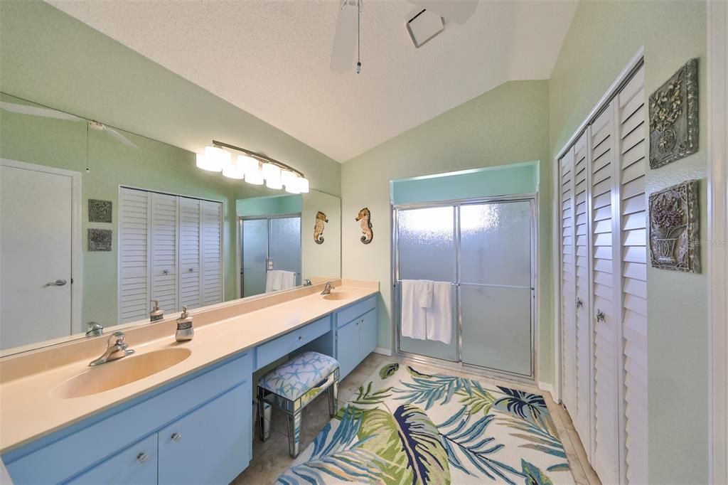 Ensuite primary bath has dual sinks, large linen/storage closet and private water closet.