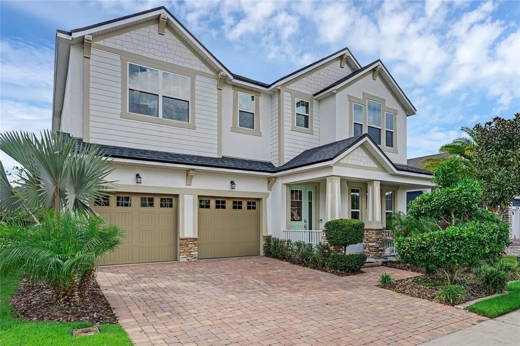 Are you ready to be the newest neighbor in sought-after Lake Nona’s premier Randal Park community? Look no further than this beautiful two-story home offering superb curb appeal in the thoughtful landscaping, paver driveway, charming accents and covered front porch!