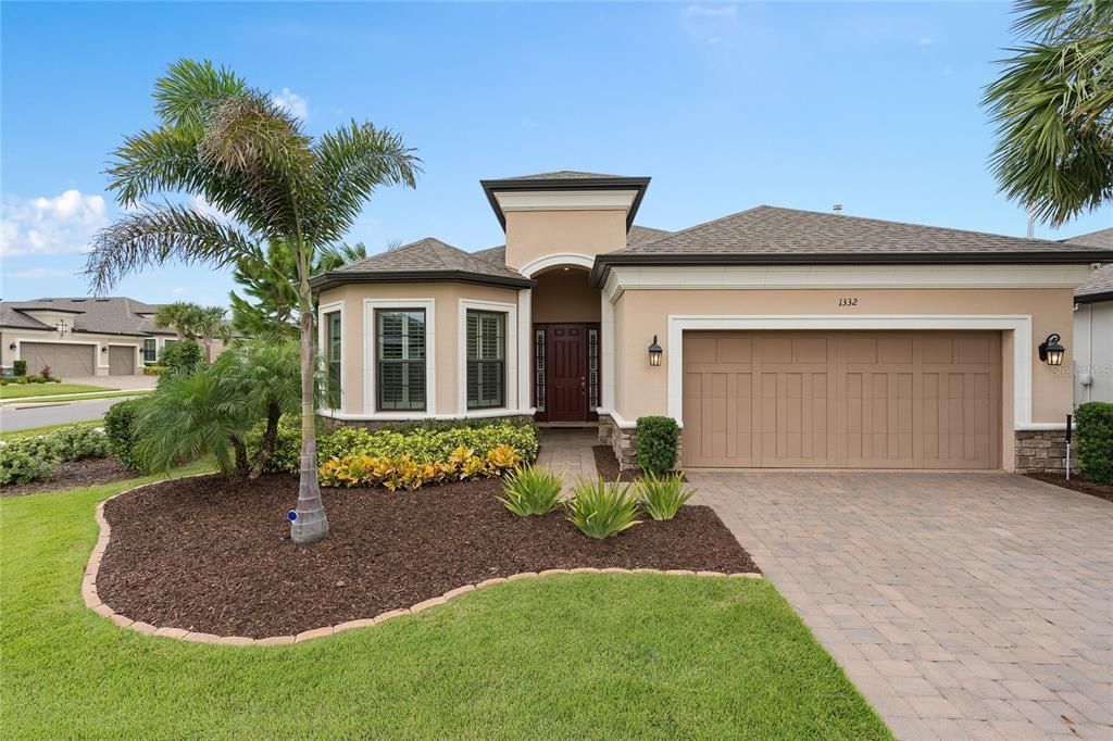 This Lazio offers a Bay Window accented by Stone and beautiful curb appeal