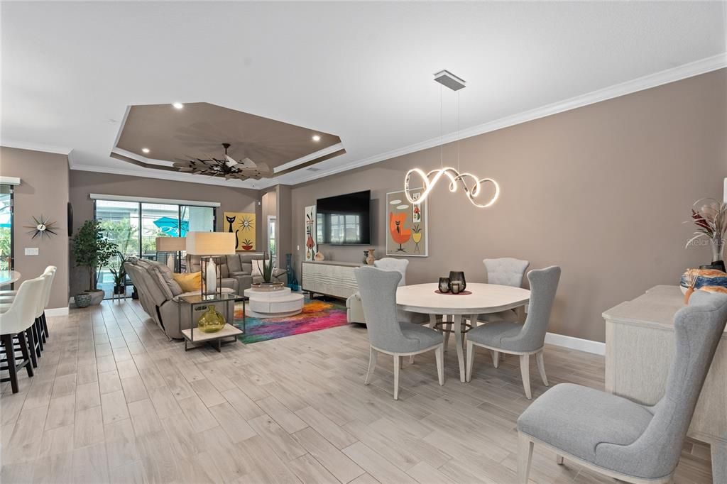 Dining Area and Family Room with a beautiful view to the Pool