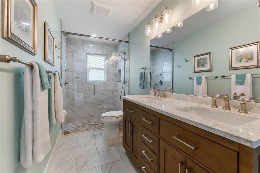 Dual Sinks & Frameless Glass Tile Shower