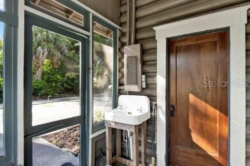 Laundry room. Wooden door goes into kitchen