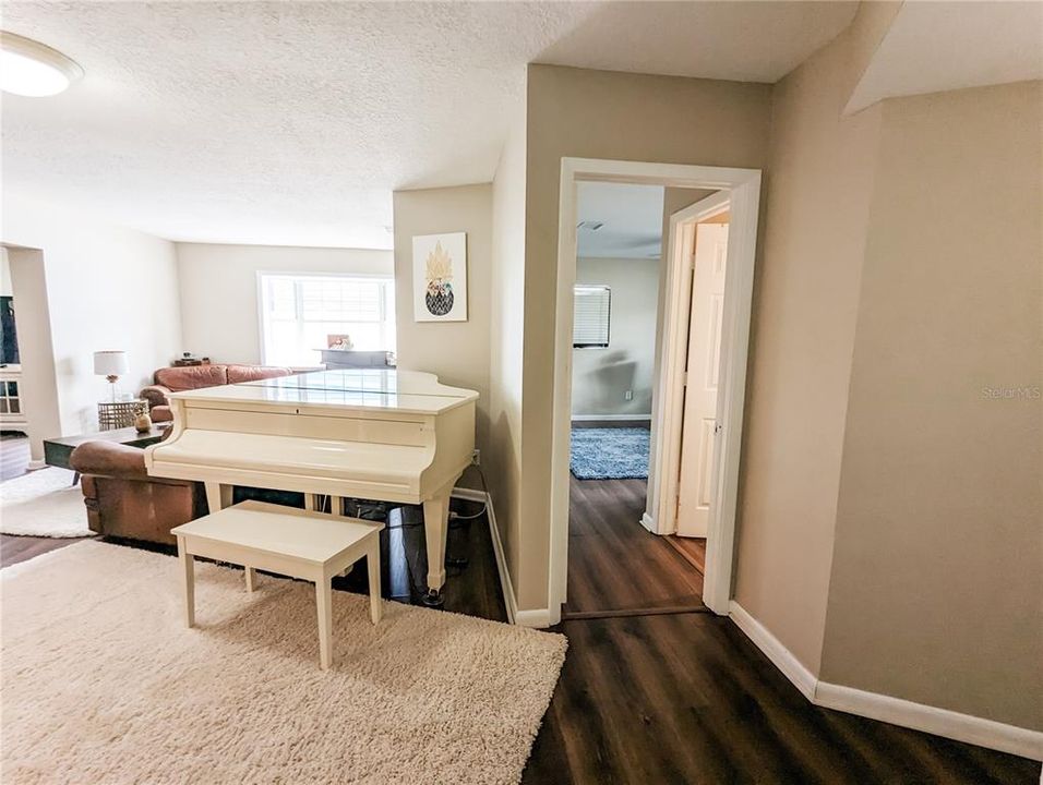 Photos are from Pre-Hurricane Helene. Living Room at front of home with entry into split plan Primary Bedroom with Ensuite Bathroom