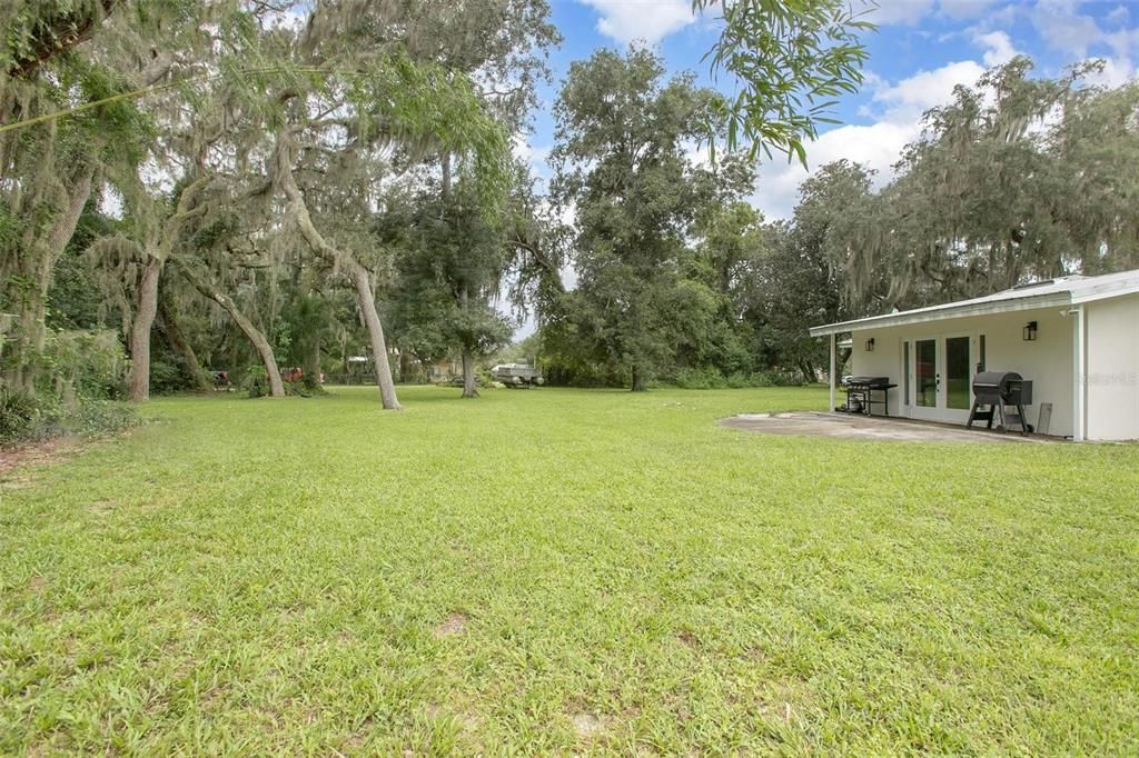 Backyard with view of Master bedroom doors