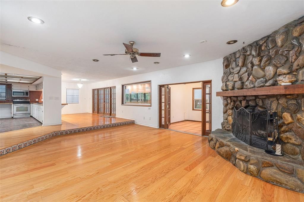 Living room with wood fire place and office space