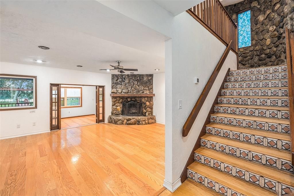 Staircase and Livingroom w/wood burning fire place