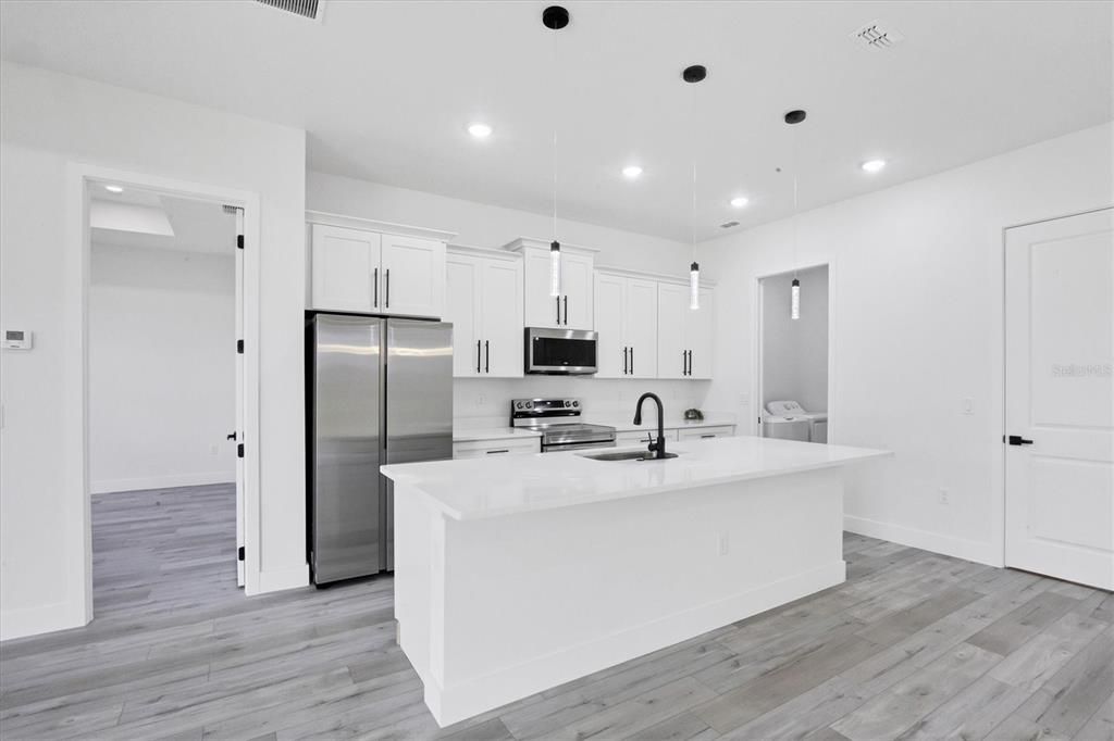 Waterfall granite counters with a breakfast bar