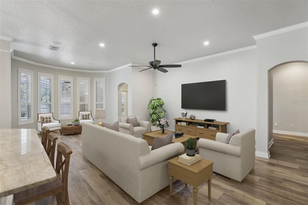 Light and bright and adorned with more of the CROWN MOLDING and PLANTATION SHUTTERS the living area, kitchen and casual dining are sure to wow even the most discerning home buyer. Virtually Staged.