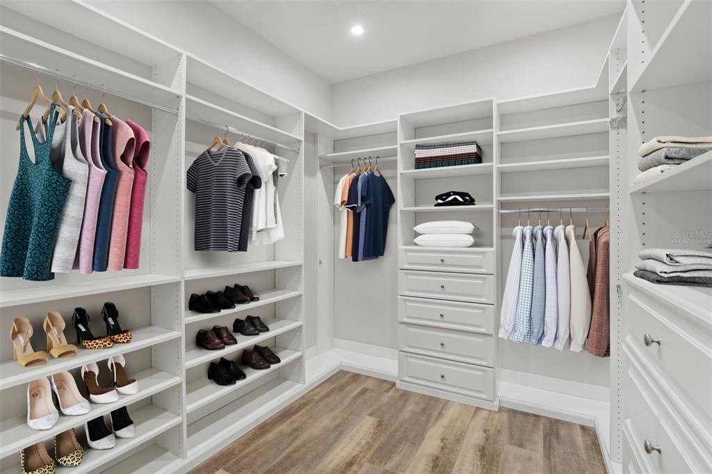 The massive WALK-IN CLOSET has a CUSTOM CLOSET SYSTEM. Virtually Staged.