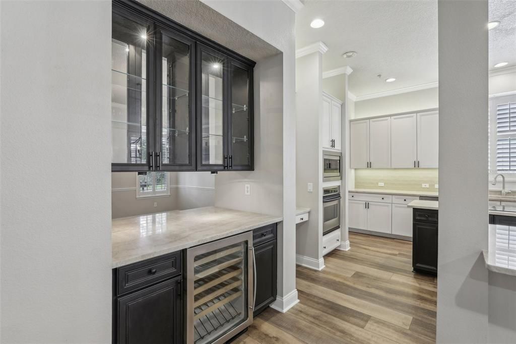 DOUBLE SIDED BAR shared by the living and dining areas.