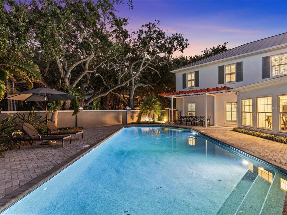 Oversized pool w/ private wall and dining area