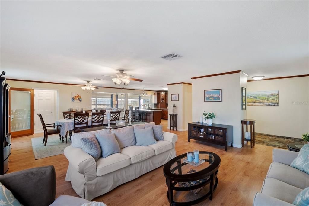 View from Living Room into Dining Room. Florida Room and Kitchen in the background.