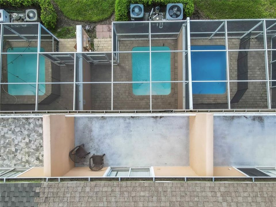 Aerial view of pool and upstairs balcony