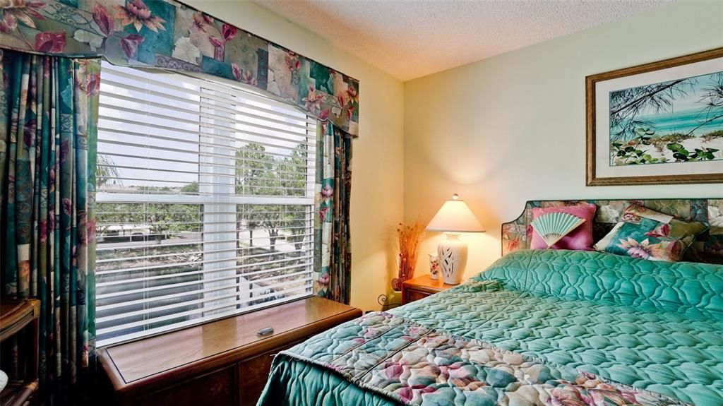 MAIN BEDROOM in this one-bedroom unit. View of pond and Gazebo