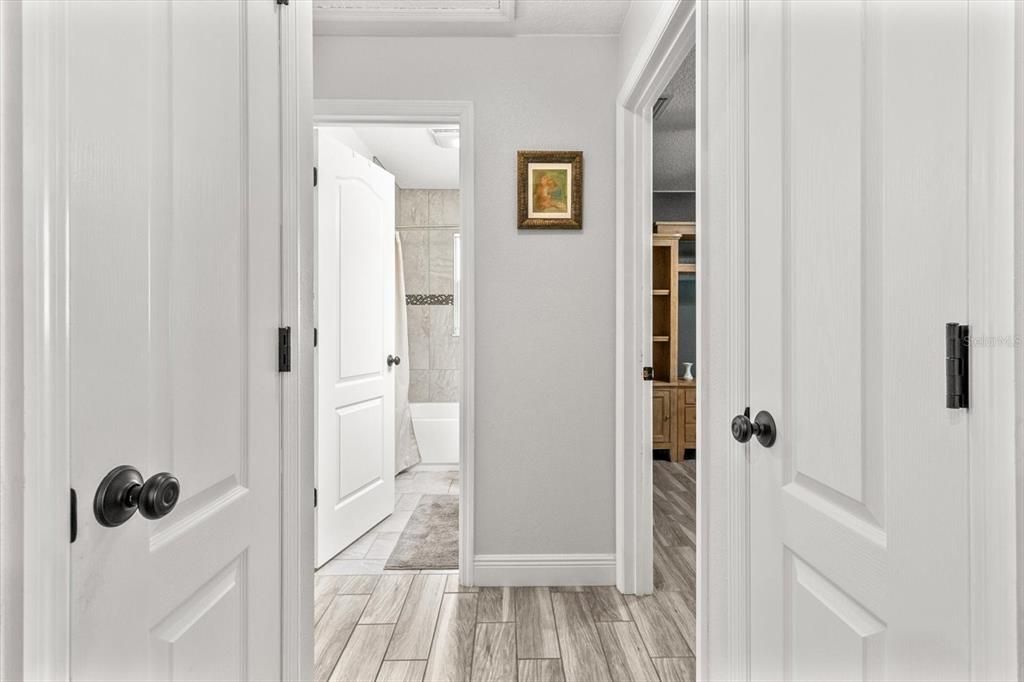 Hallway to Bedrooms 2&3 and Bathroom 2...Closets on Left and Right