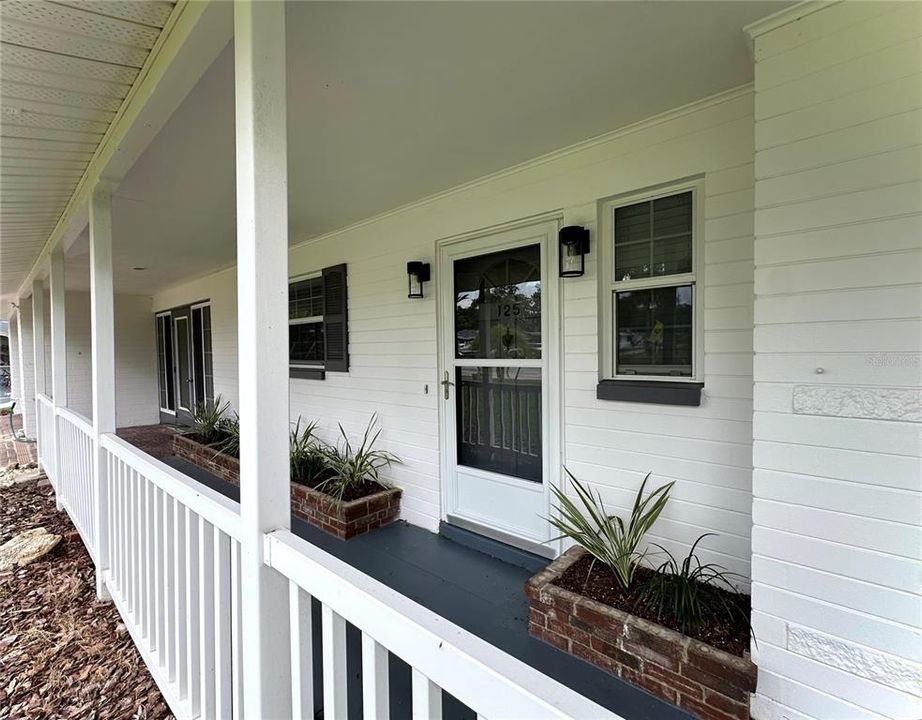 Covered Front Porch with Brick Planters