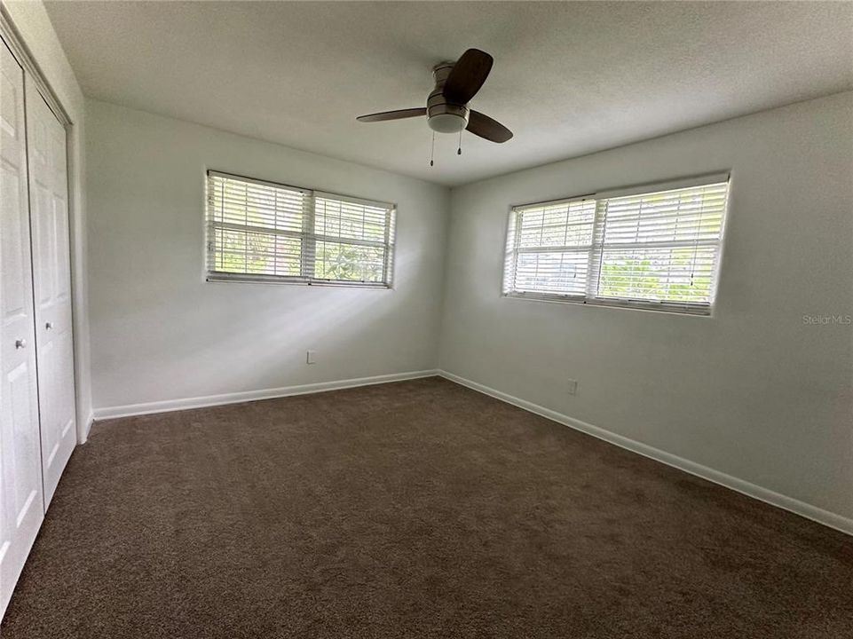 Guest Bedroom with Carpet and Ceiling Fan