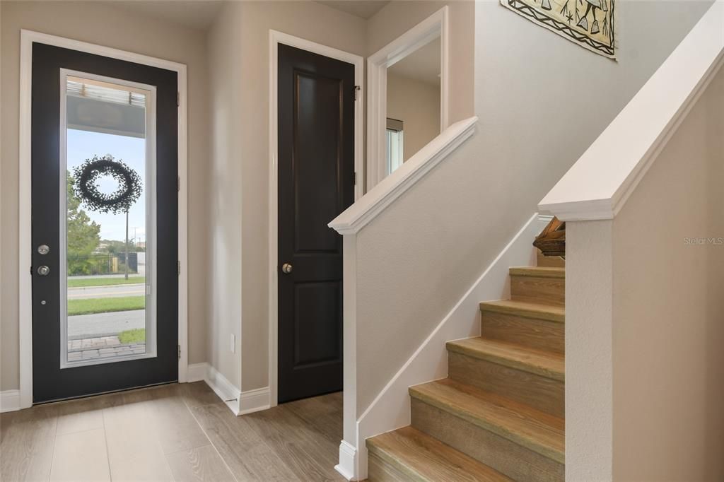 Foyer with a hall closet and Powder Room