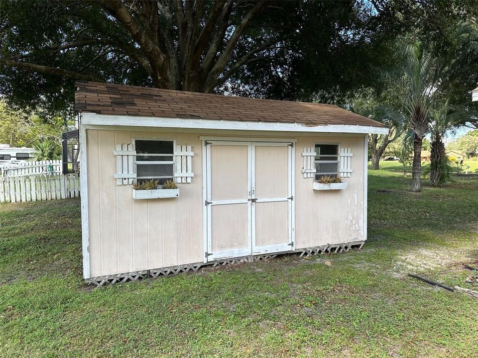 This storage shed also conveys with the home.