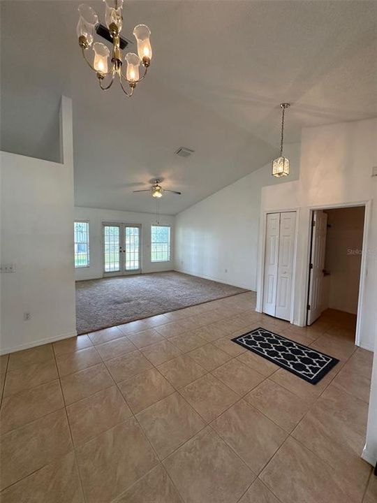 Upon entering the home, the dining area is to your left.  There are a second set of French doors in the formal living room leading to the covered porch.