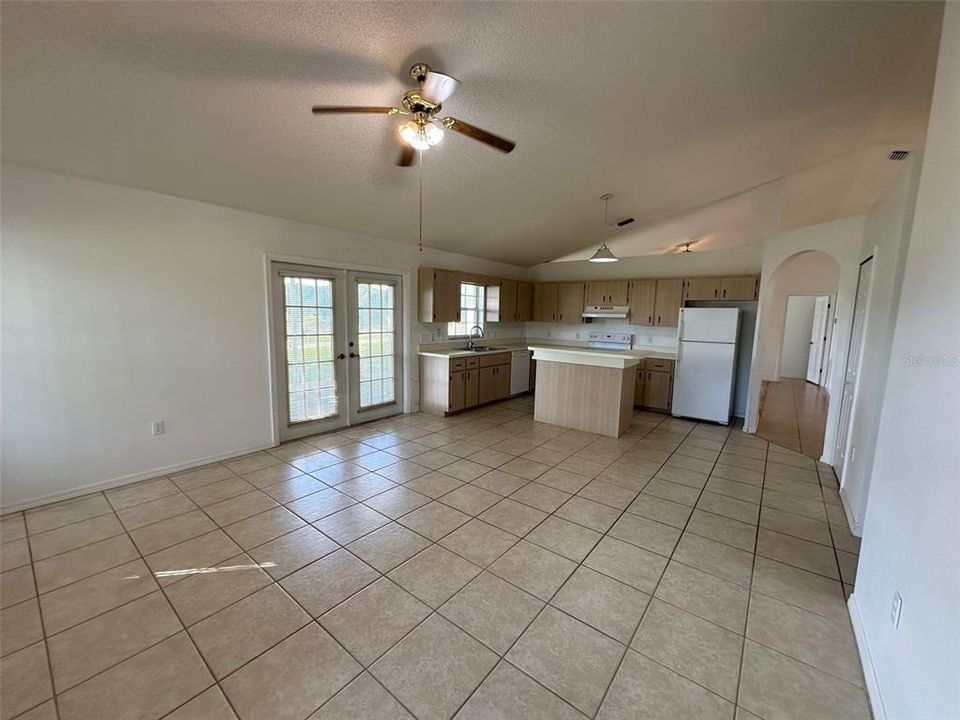 The Family Room is just off the kitchen, and the French doors lead to a large covered porch.