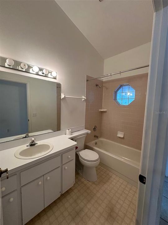 The second bathroom offers a tub/shower combo and a linen closet just outside the door.