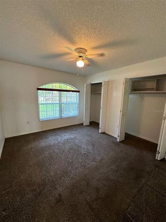 Bedroom 2 is located at the front of the home and has ample closet space.