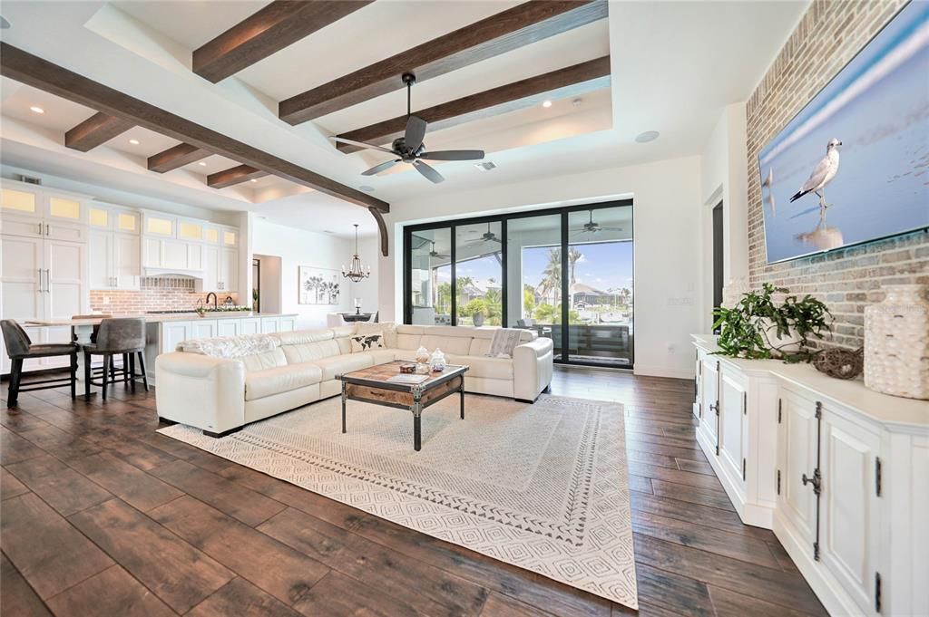 On trend tile flooring, beams and reclaimed brick accent walls