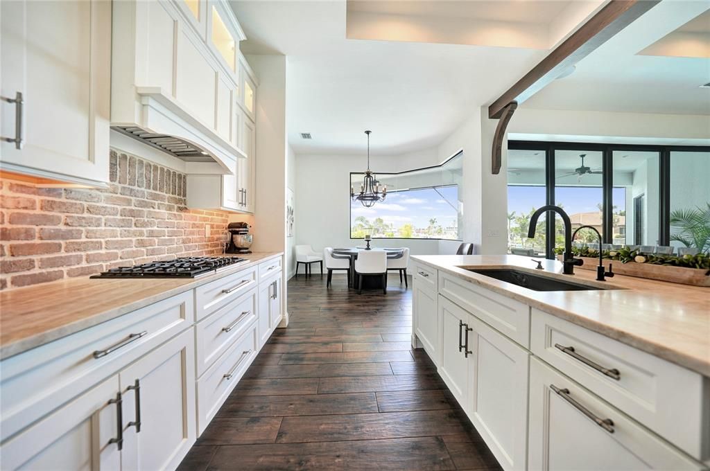 Soft close custom cabinetry with hidden dishwasher and refrigerator