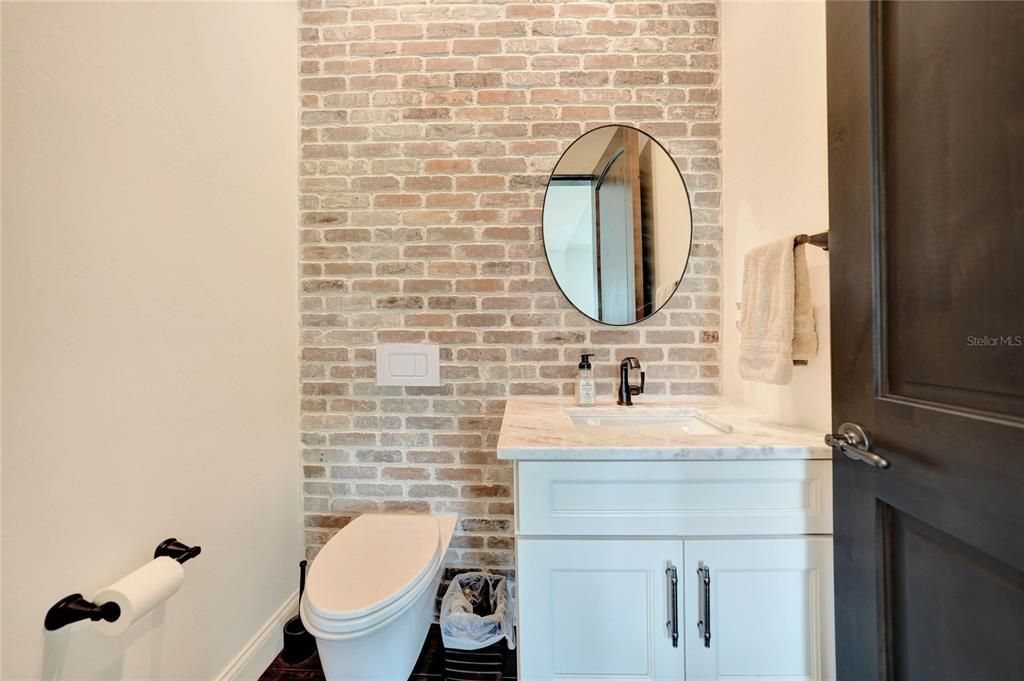 Office ensuite half bath with floating cabinet and Toto toilet