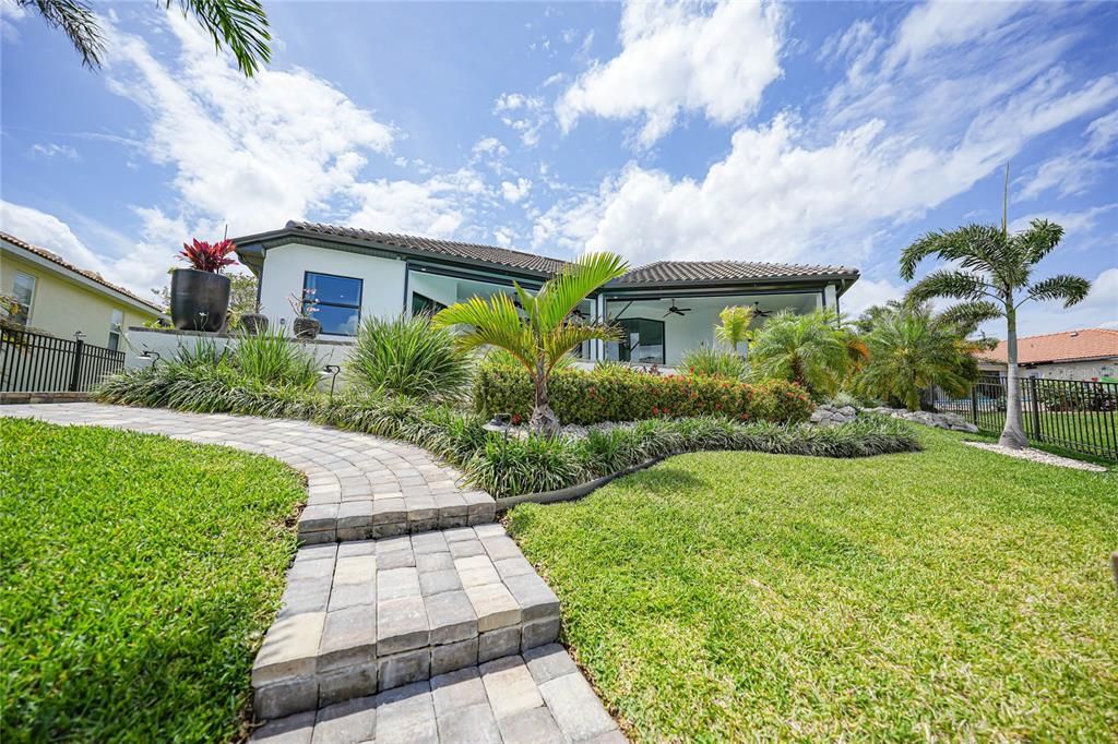 Fenced in yard, terraced walkway to the dock and extensive mature land-scaping