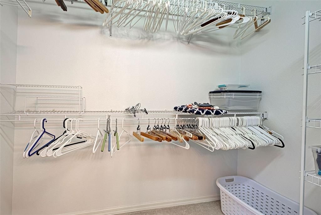 Primary bedroom's walk in closet for all of your storage needs.