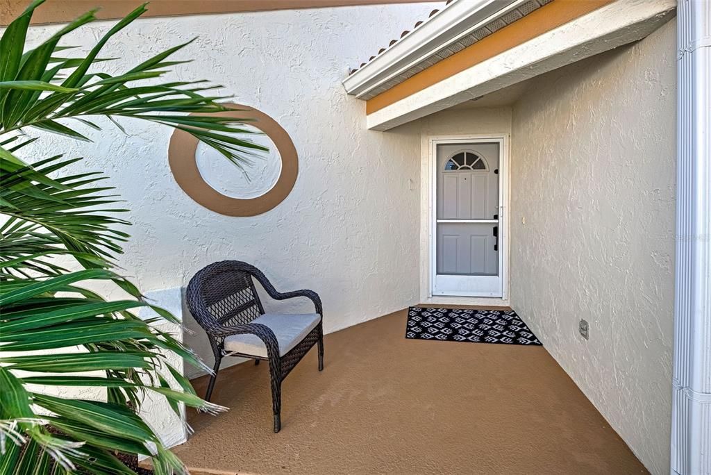 Welcoming entry way with sitting area.