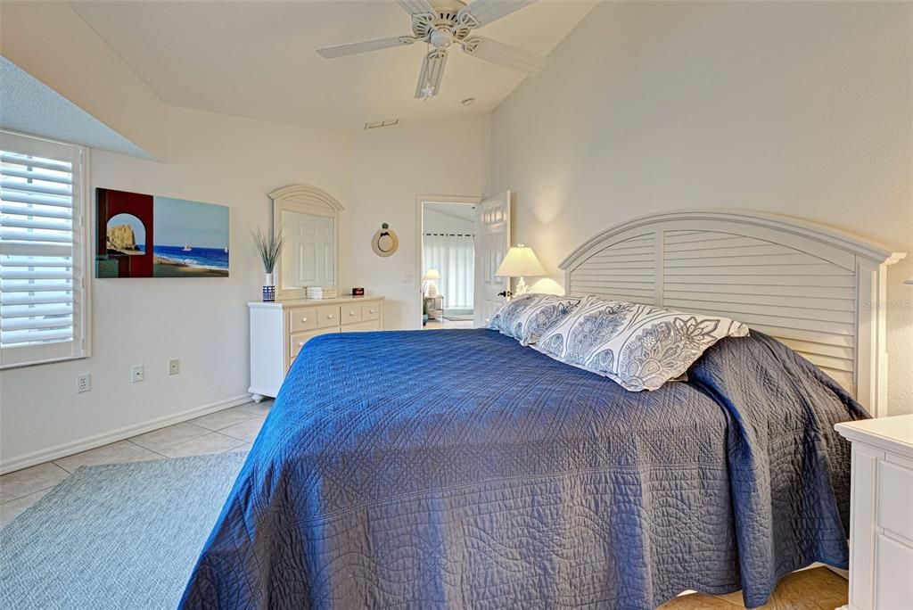 Primary bedroom with diagonal ceramic tiles for easy care.