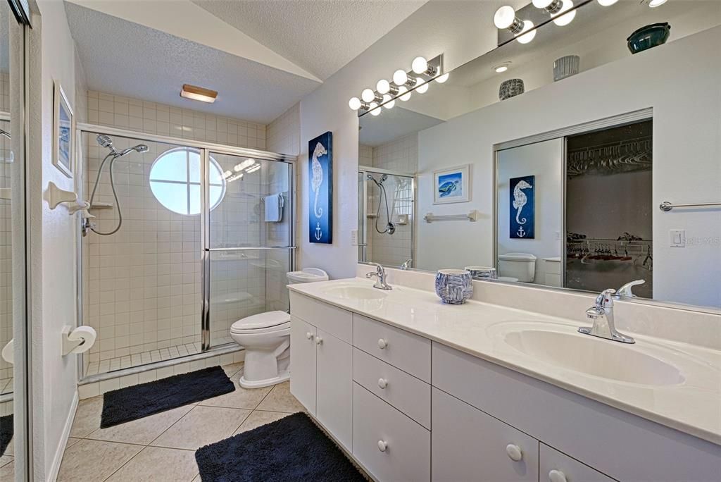 Ensuite bathroom with tiled, walk-in shower.