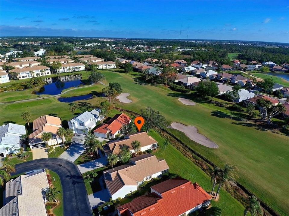 Bird's eye view of villa with sweeping golf views.