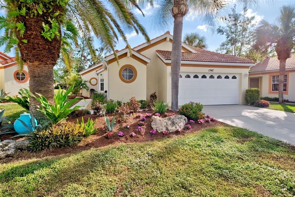 Lush, tropical landscaping greet you and the low HOA fee covers so much:  yard care, tree trimming, exterior painting, cable and even roof cleaning and pressure washing.  Bonus:  home not in a flood zone.