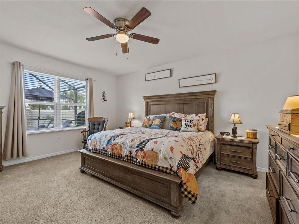 Primary bedroom with pool view