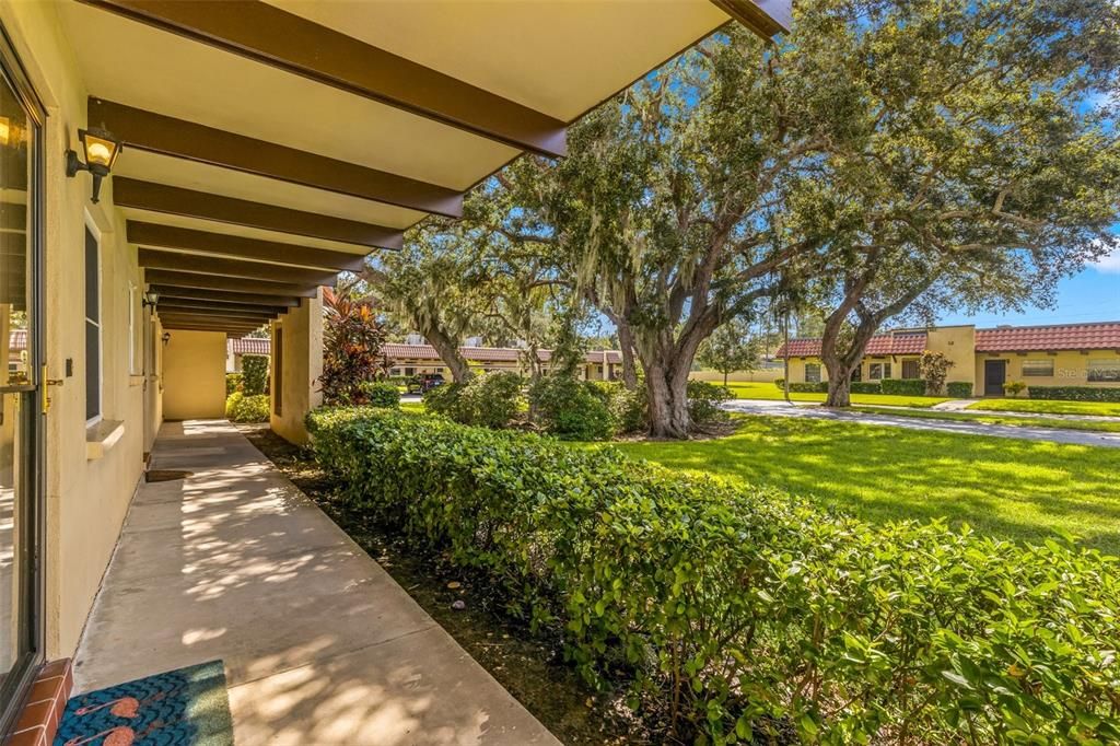 The view from your front door, mature landscaping, not a carport!